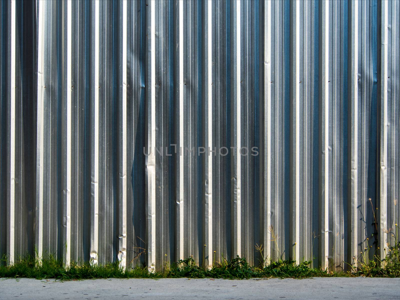 Metal sheet fence enclosed around the construction site by Satakorn