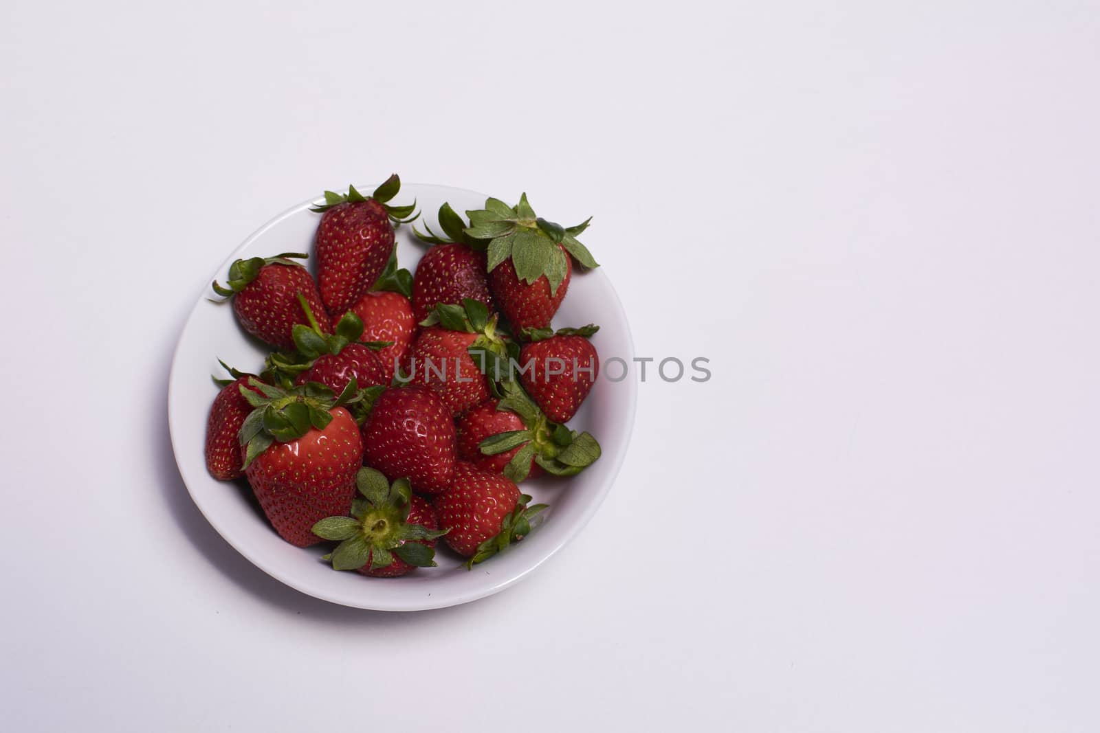 Bowl full of ripe strawberries ready to eat by raul_ruiz