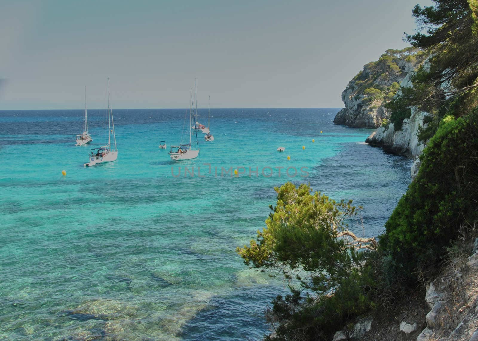 Sailboats waiting in the calm and blue sea by raul_ruiz