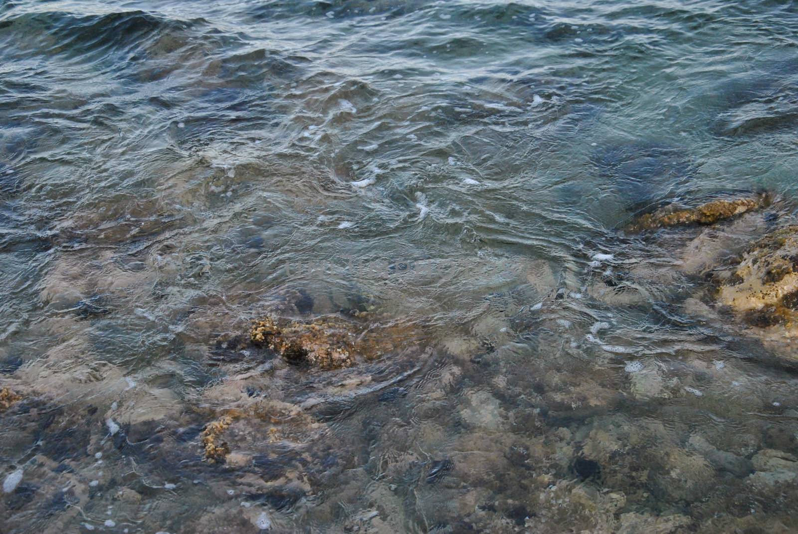 the sea water dancing with the rocks blue sea