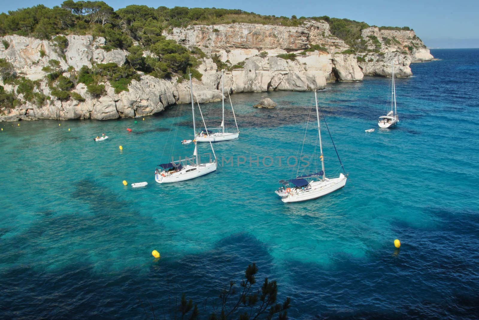 Sailboats waiting in the calm and blue sea, The bright summer