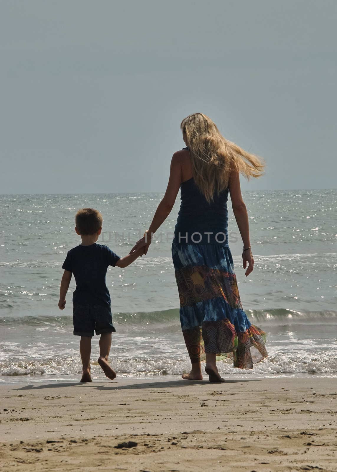 Mother and son love on the beach by raul_ruiz