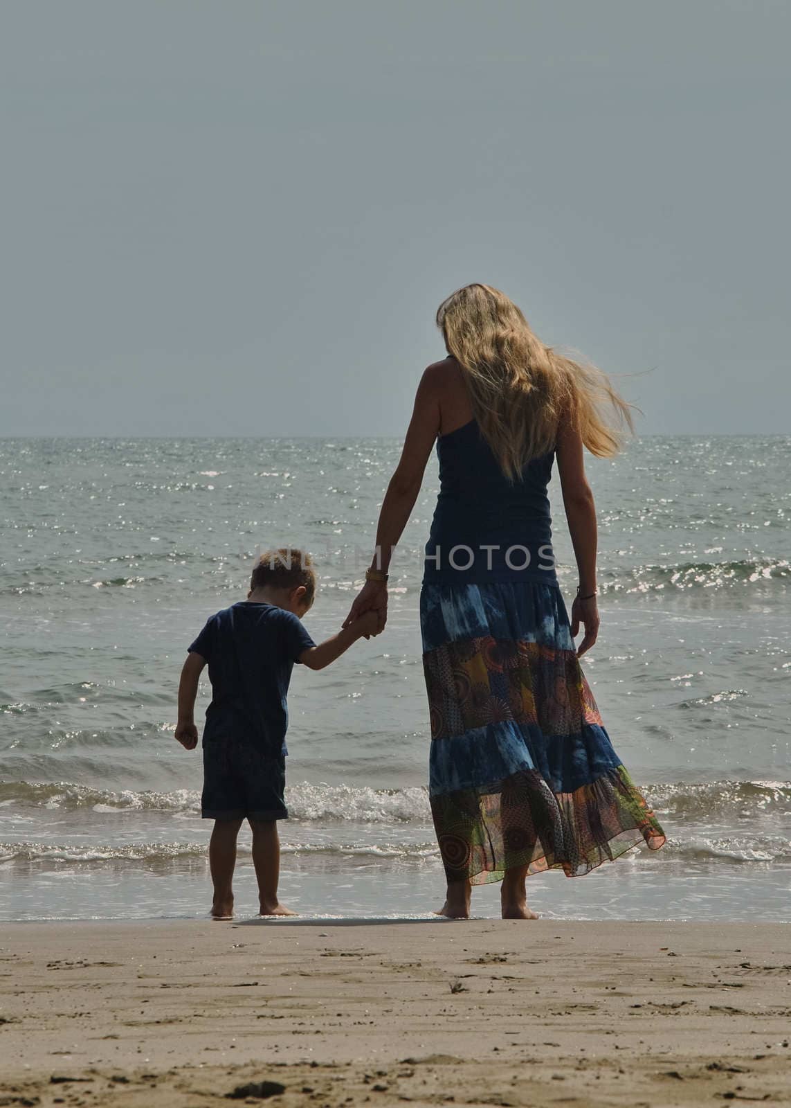 Mother and son love on the beach. Love of mother