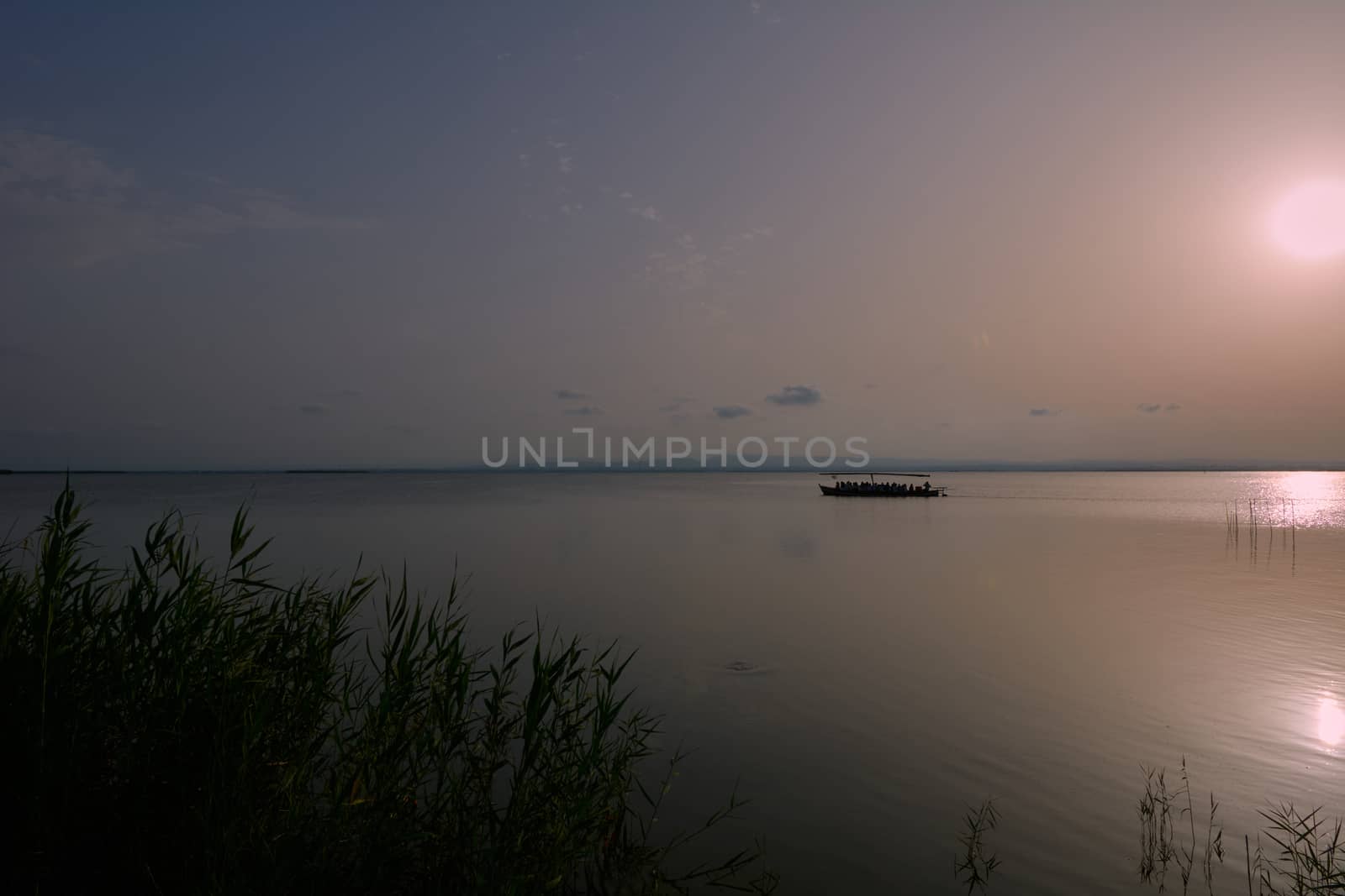 Reflections of the sunset in the lagoon by raul_ruiz