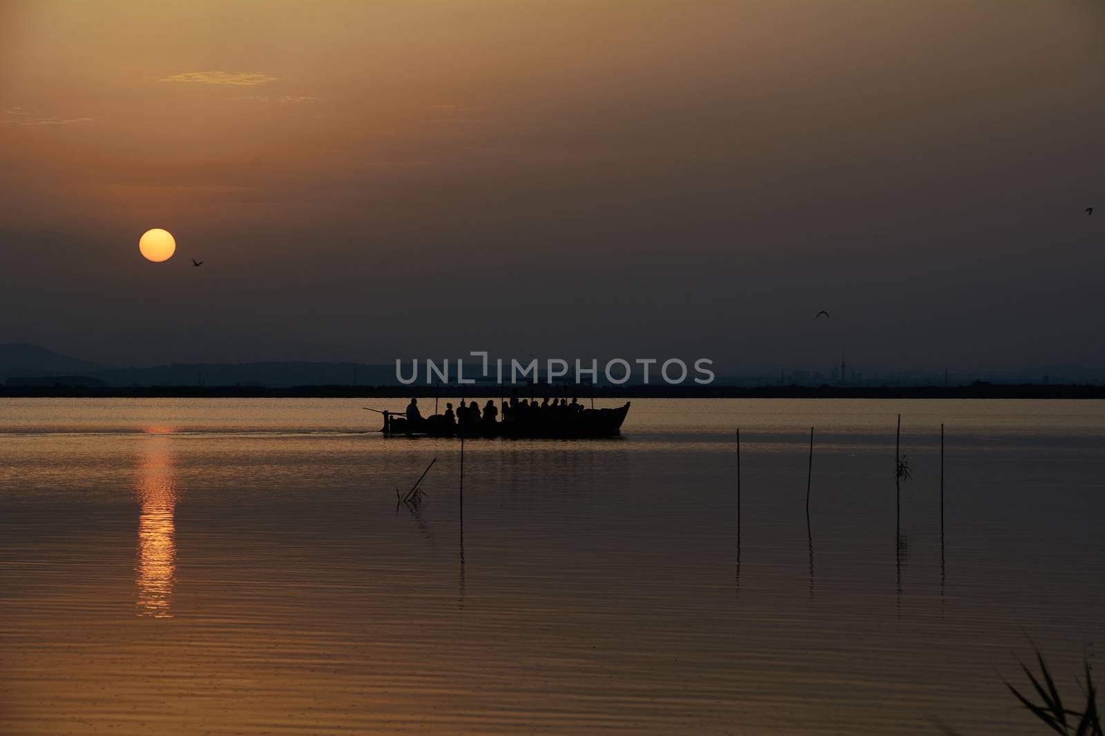 Reflections of the sunset in the lagoon. Sunset lights