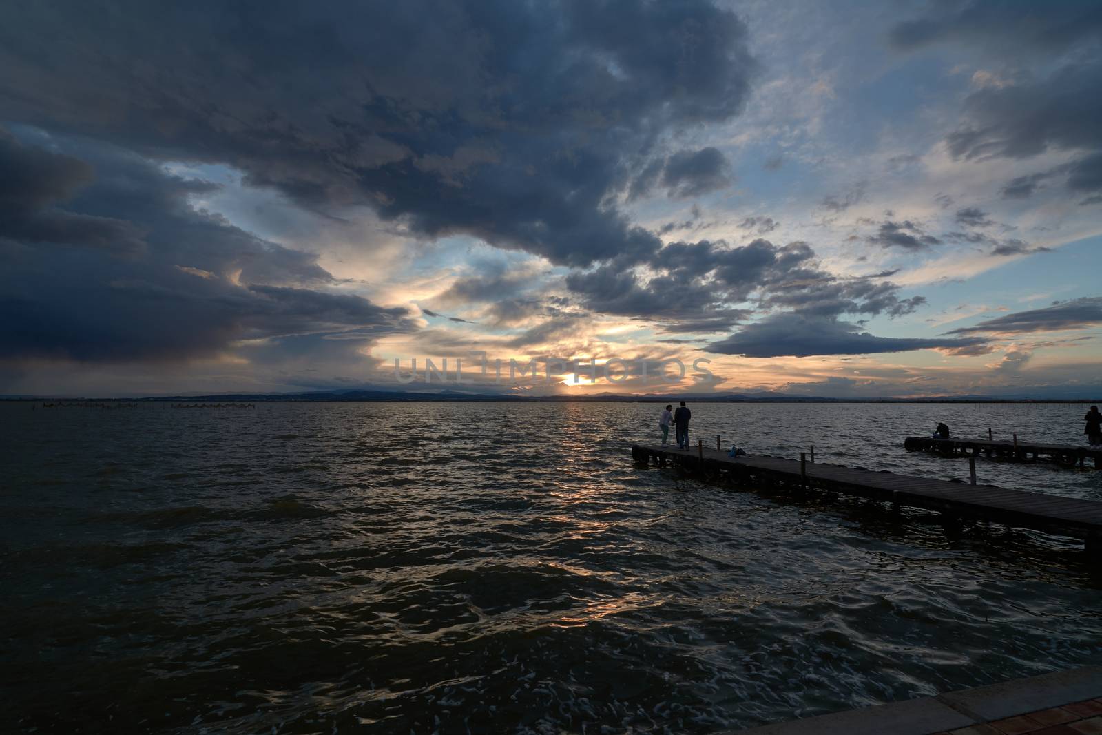 Spring sunset from the old wooden jetty. Sunset colors