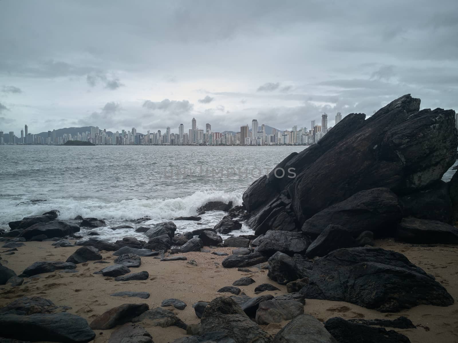 Skyscrapers after the storm on the beach by raul_ruiz