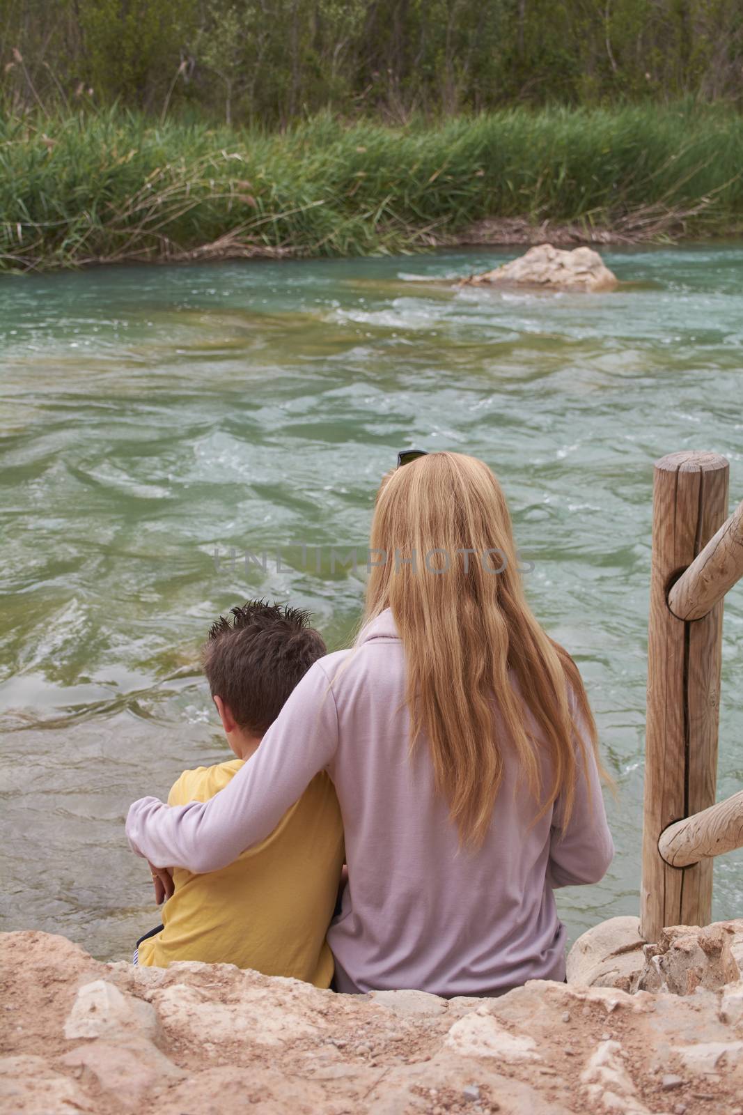 Mother and son watching the mighty river, Mothers love