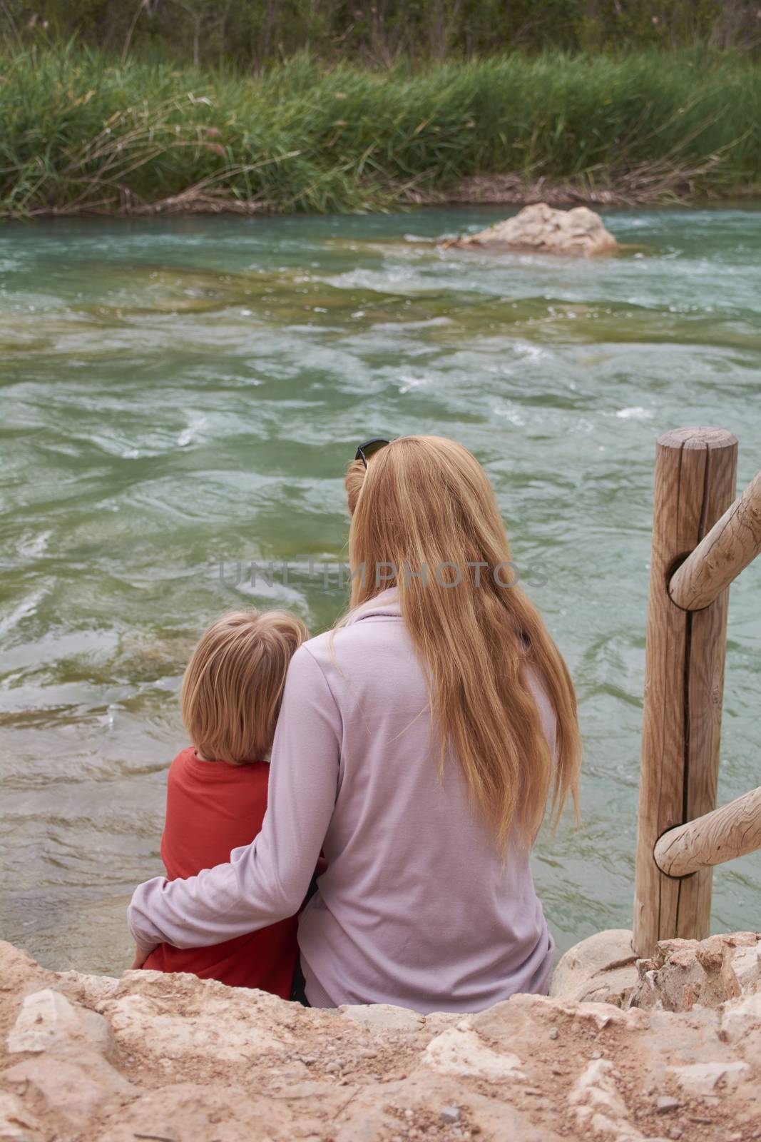 Mother and son watching the mighty river by raul_ruiz