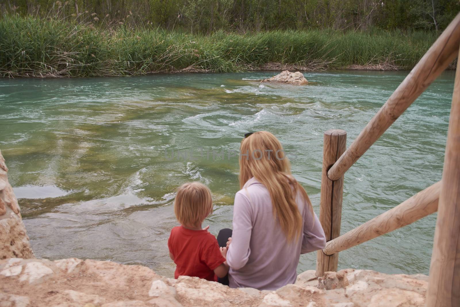 Mother and son watching the mighty river, by raul_ruiz