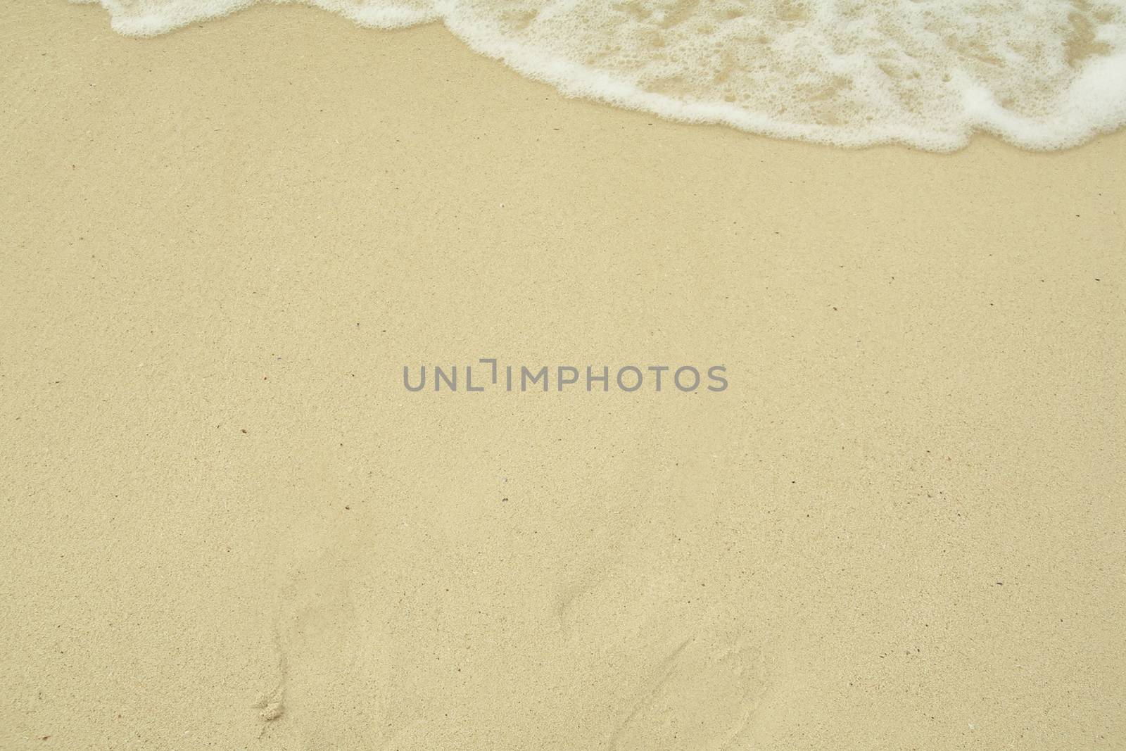 Small waves reaching the shore of the beach, Caribbean beach with turquoise waters