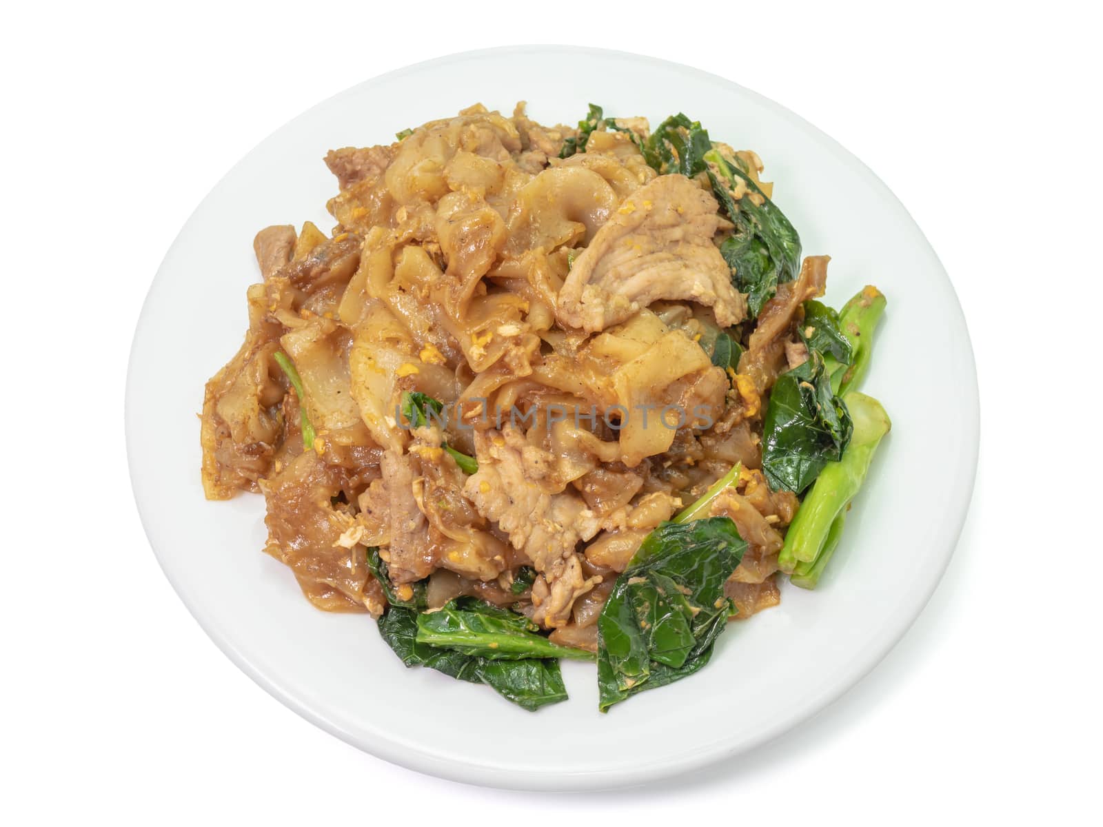 The close up of Fried Noodle with soy sauce on white plate on white background.