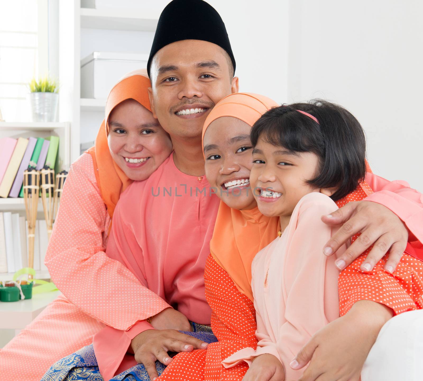 Asian Muslim Malay family at home. Malaysian people living lifestyle.