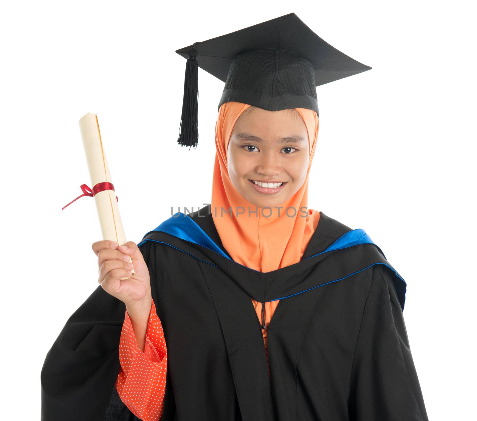Female student in graduation gown, standing isolated white background.