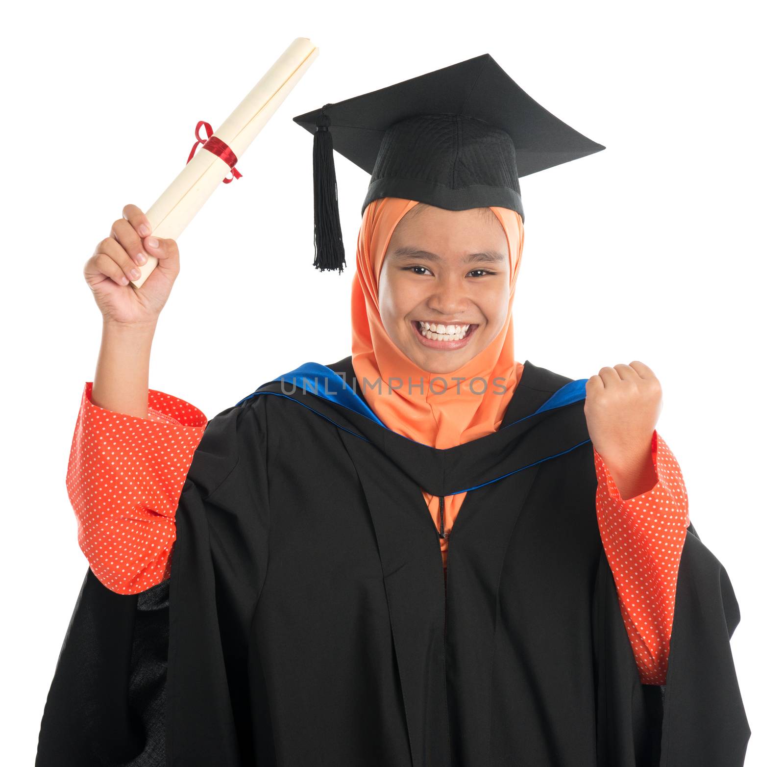 Female student in graduation gown, standing isolated white background.