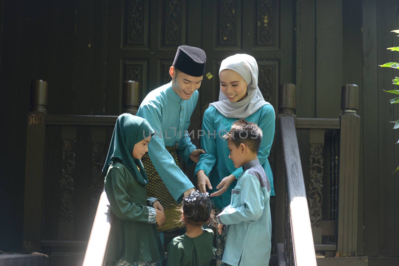 Muslim family greeting, Hari Raya Eid Al-Fitr concept. 