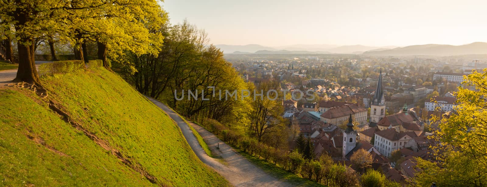 Panoramic view of Ljubljana, capital of Slovenia. Roooftops of Ljubljanas old medieval city center seen from Ljubljanas castle park at sunset by kasto