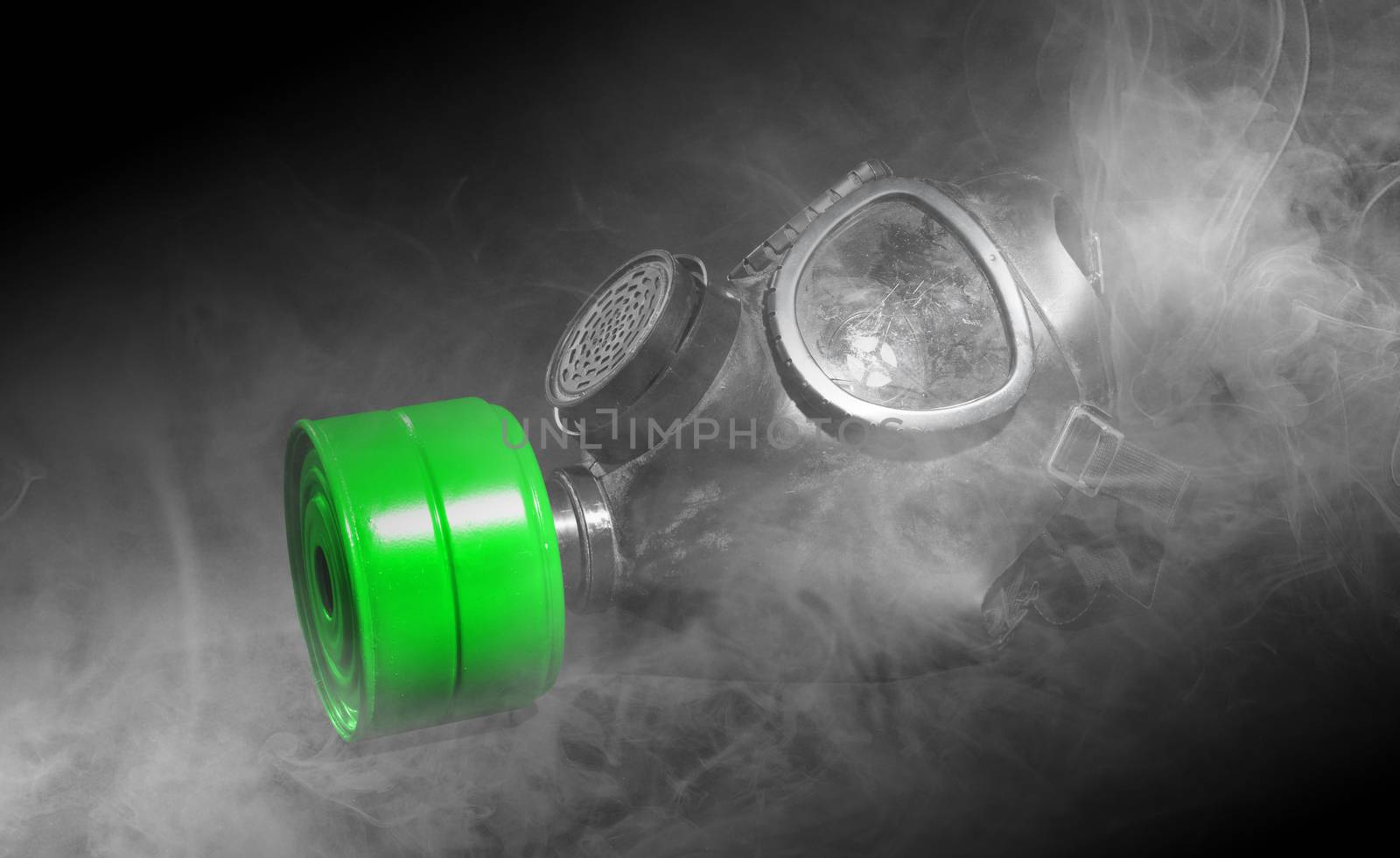 Vintage gasmask isolated on black - Smoke in the room - Green fi by michaklootwijk