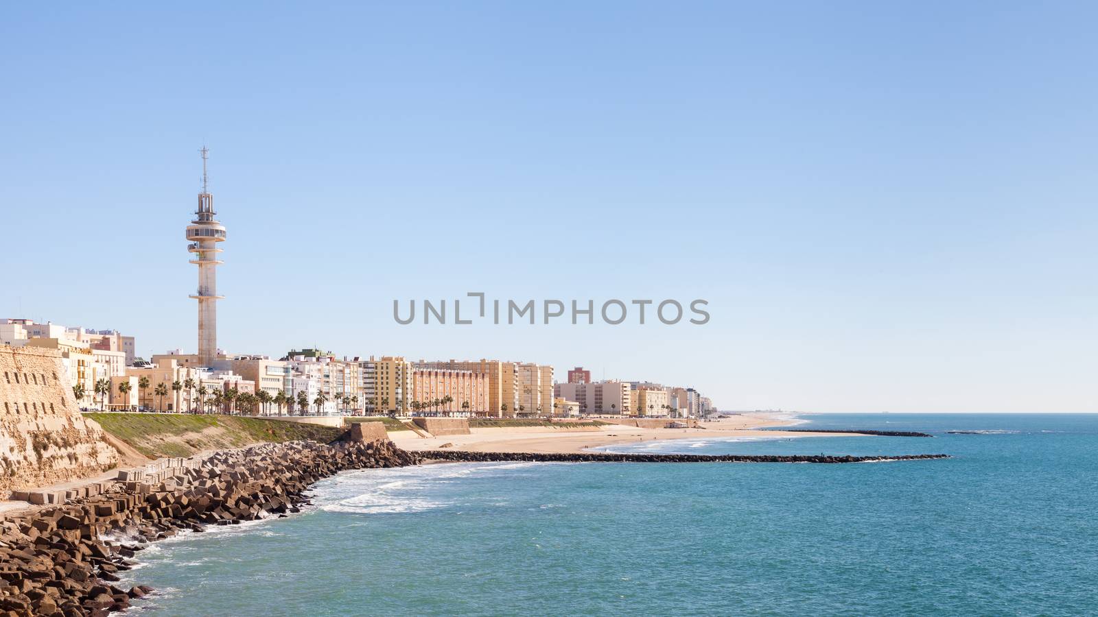 The Cadiz waterfront in Spain and the view along Playa Santa Maria del Mar.