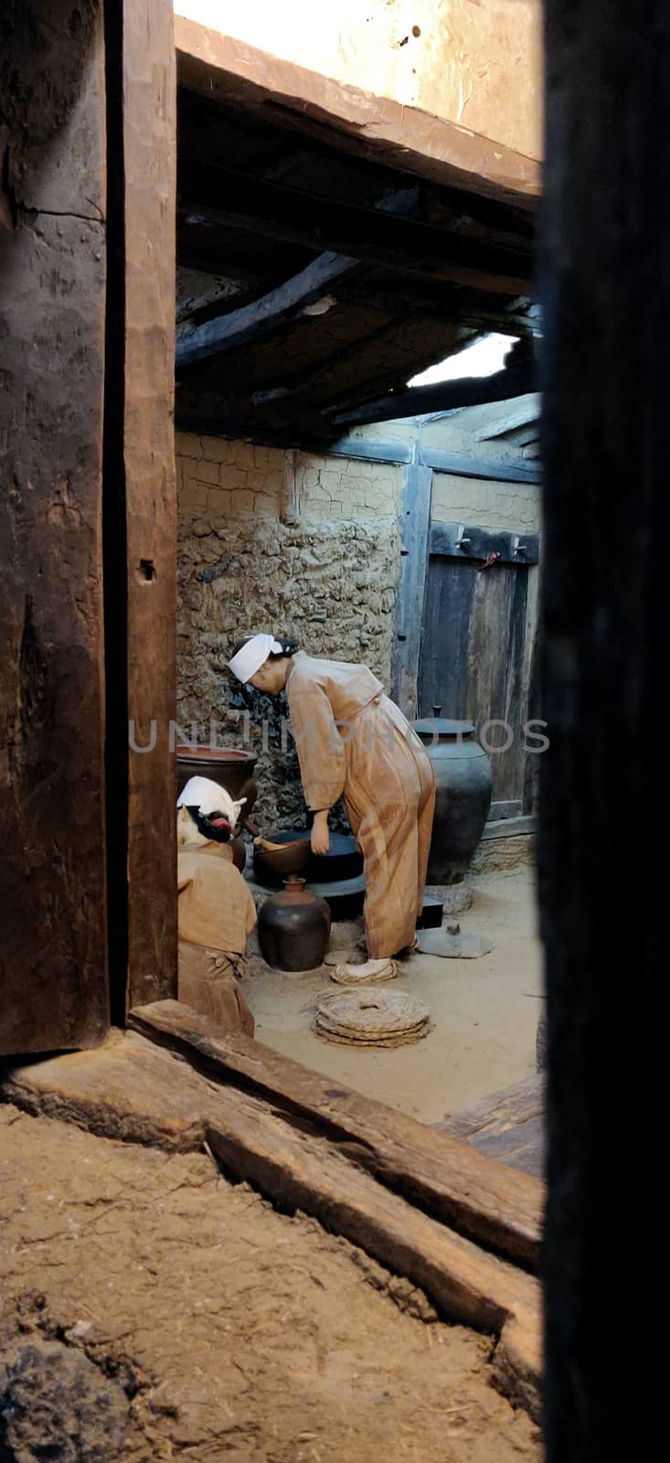 A couple in museum of national folklore museum. A still of Traditional Korean people in ancient traditional korean household.