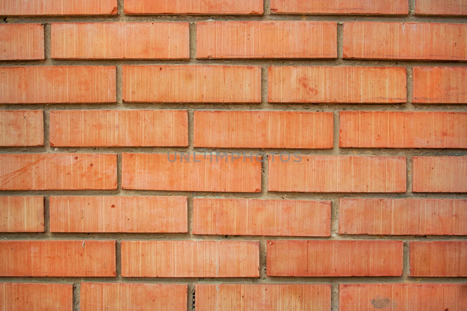 Red rough bricks wall texture, background
