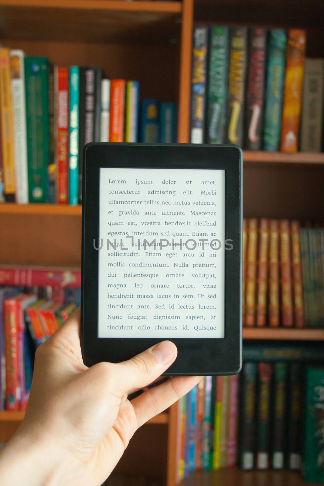 E-book in man's hand with lorem ipsum text