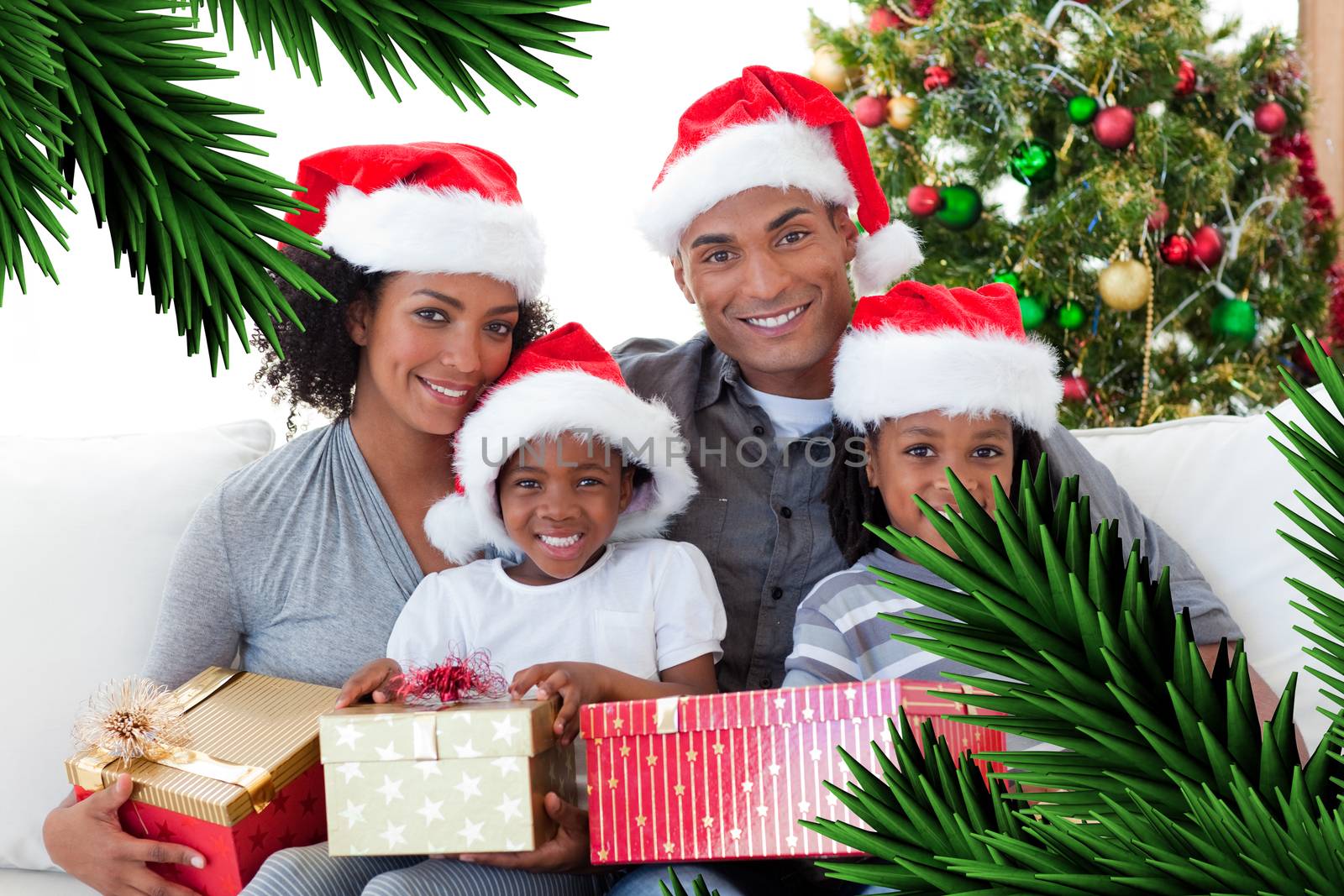 Composite image of family holding Christmas presents against digitally generated fir tree branches