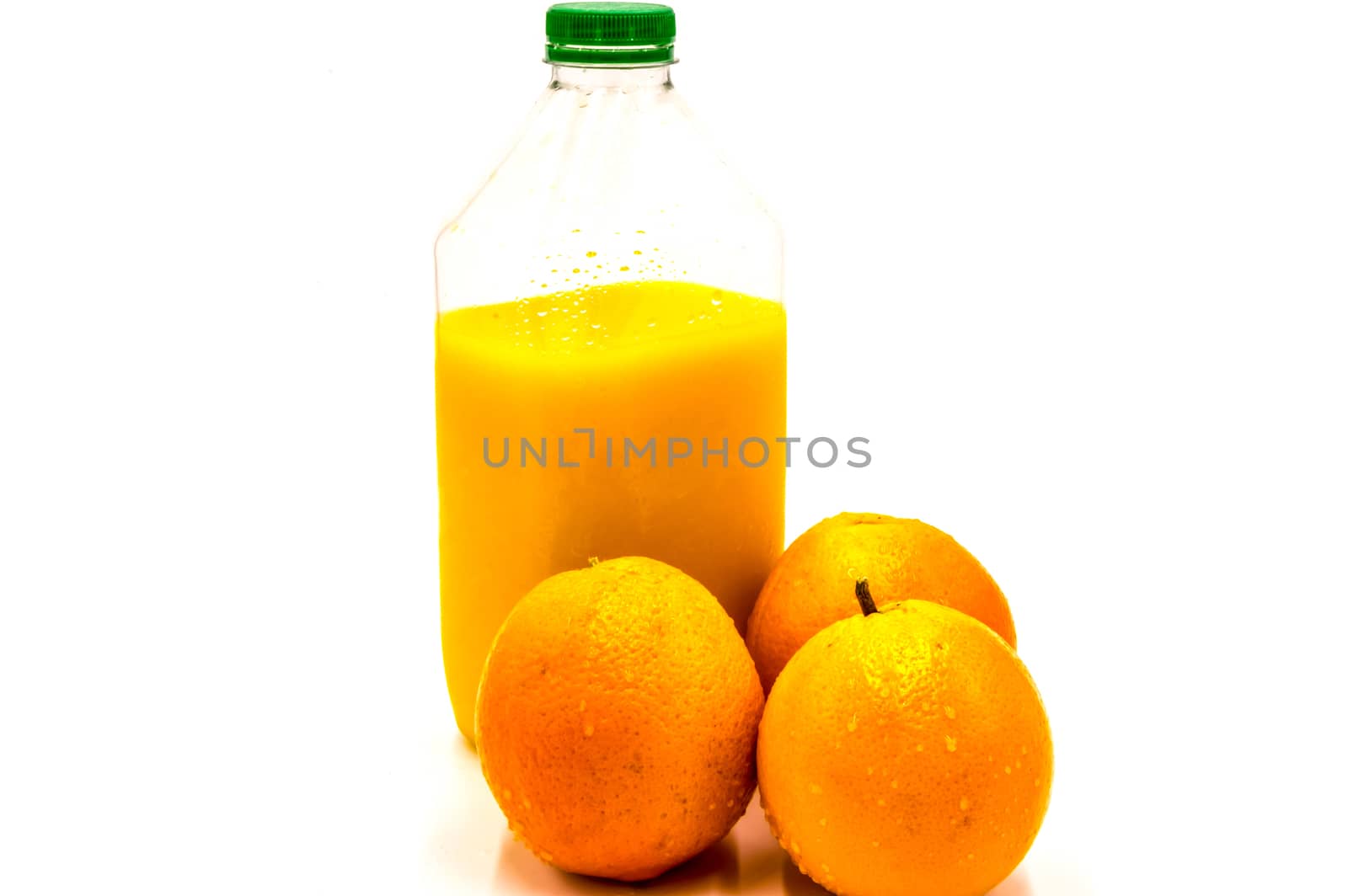 Bottle of fresh juice with oranges by Philou1000