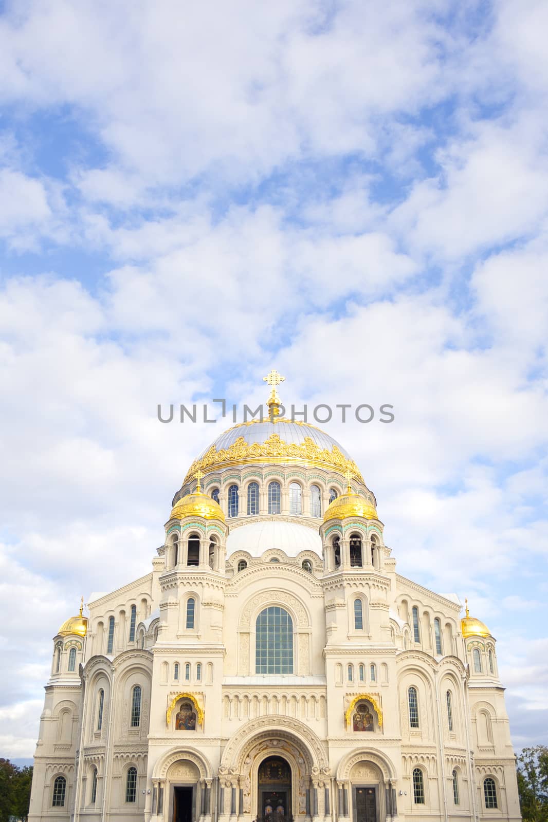 Nicholas the wonderworker's church on Anchor square in kronstadt town Saint Petersburg. Naval christian cathedral church in russia with golden dome, unesco architecture at sunny day vertical image