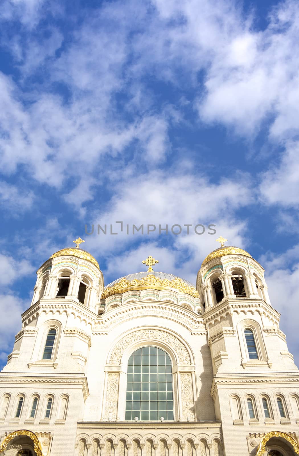 Nicholas the wonderworker's church on Anchor square in kronstadt town Saint Petersburg. Naval christian cathedral church in russia with golden dome, unesco architecture at sunny day vertical