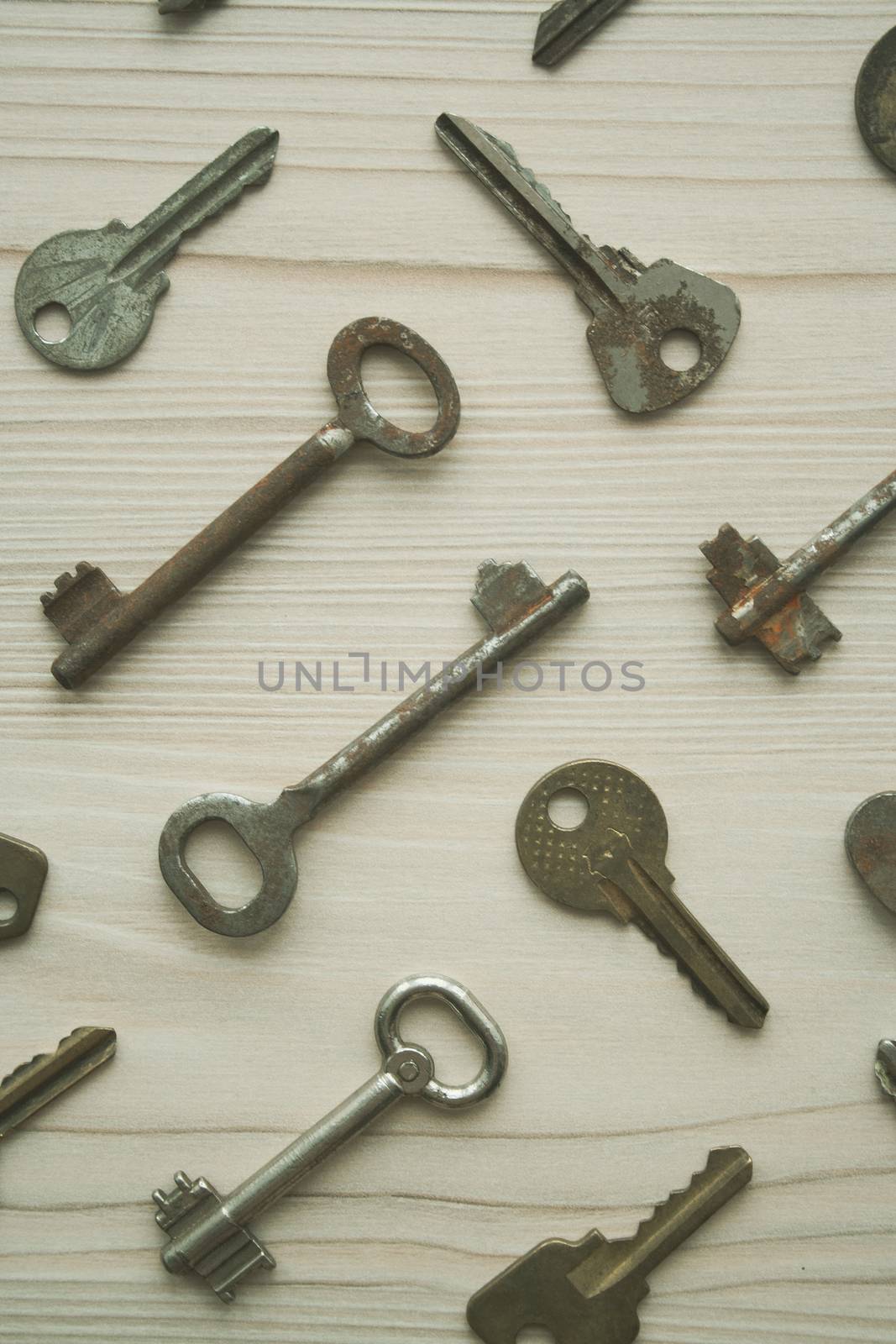 Top view of many old rusty keys background. Many keys Access, security, enter, choice, solutions of problems concept, symbol. Vertical