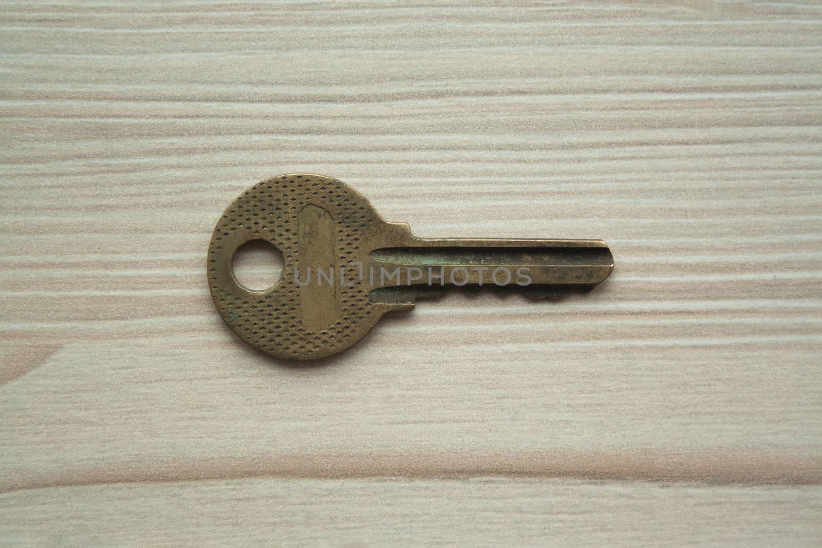 Close up macro shot of old rusty grunge key top view. Single key. Access, security, enter