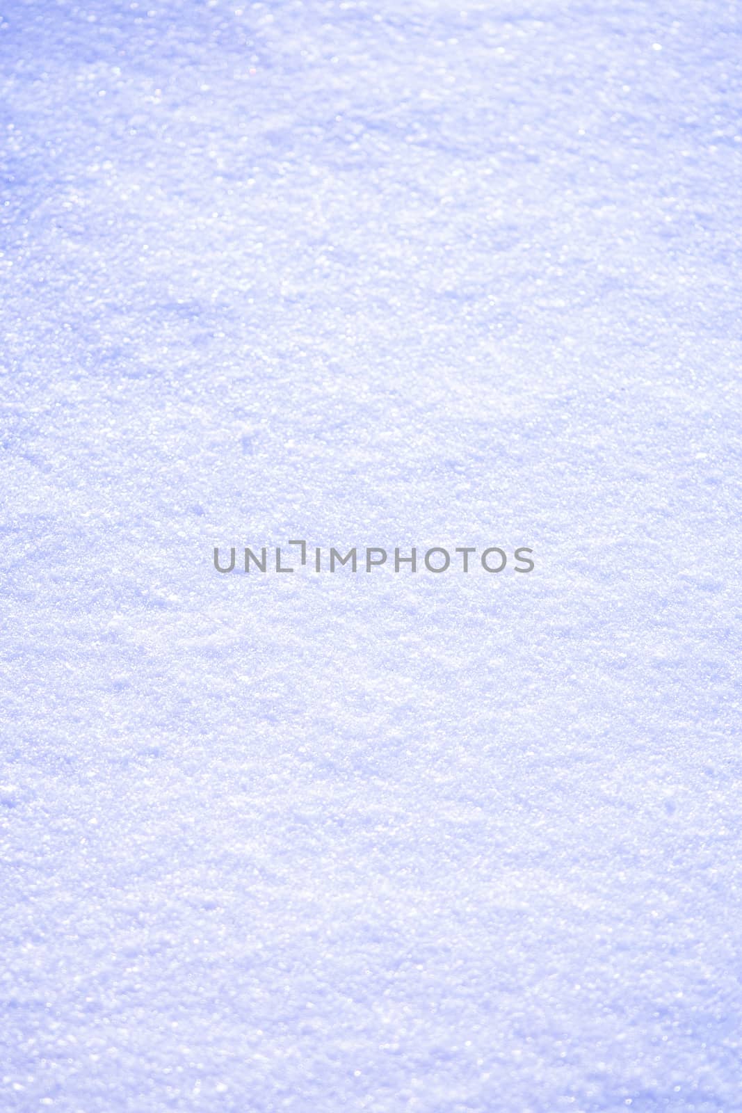 Snow surface background close up at sunny winter day
