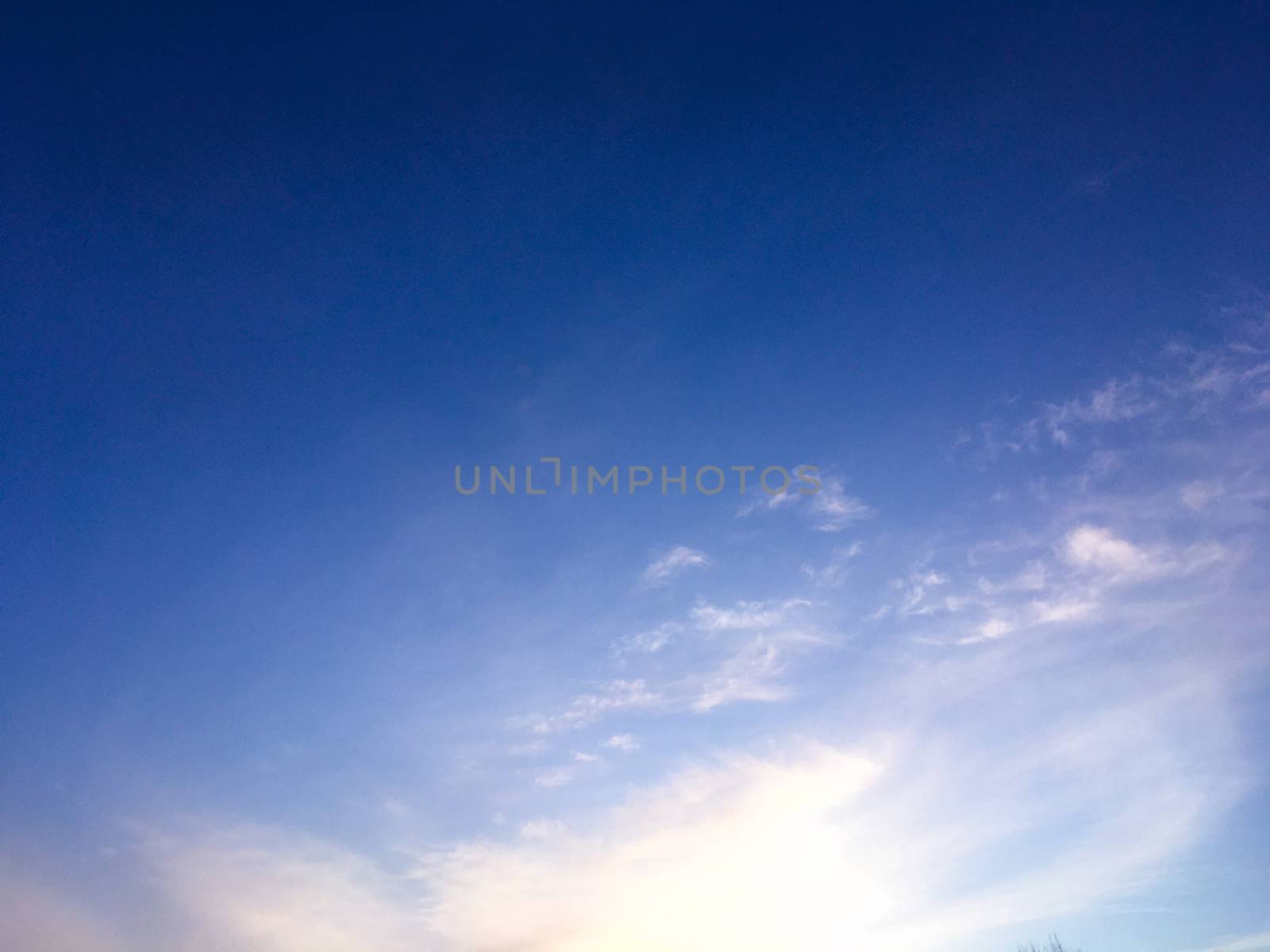 Evening purple sky background. The sky before the night. Beautiful clouds on evening sky backdrop