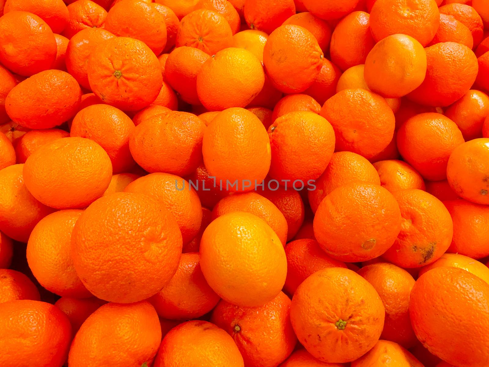 Fresh tangerines on a market stall. Fresh mandarin oranges fruit or tangerines as background