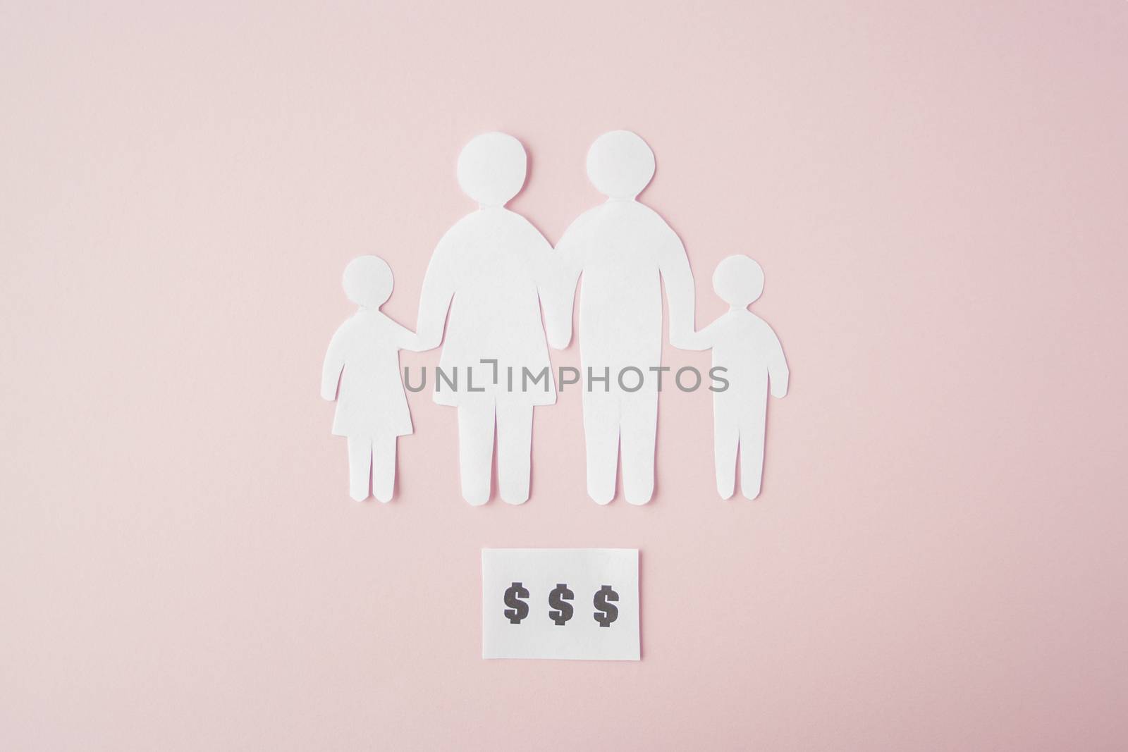 paper family cut out on bright pink background, family home, foster care, family mental health, budget and money concept. Paper family with phrase quote Dollars 