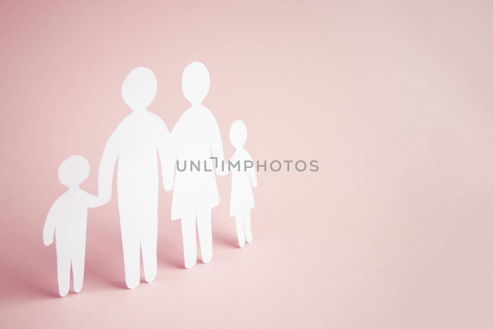 paper family cut out on bright pink background, family home, foster care, family mental health, homeschool education concept. 