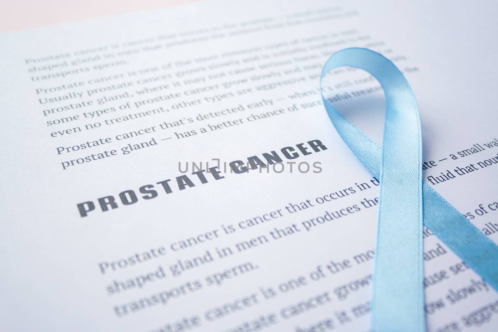 Prostate cancer quote on white paper list article with blue ribbon November Prostate Cancer Awareness month