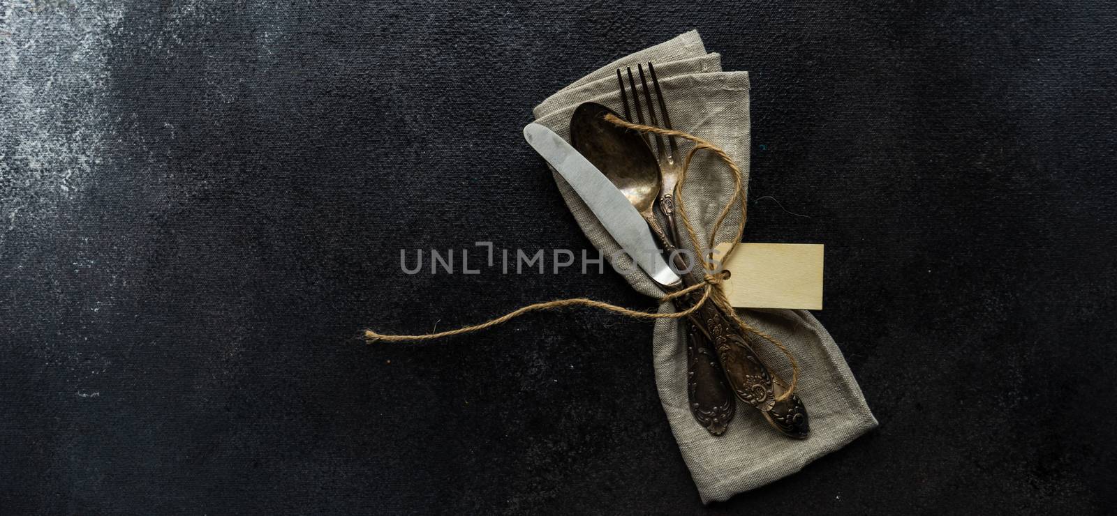 Table setting on concrete background by Elet