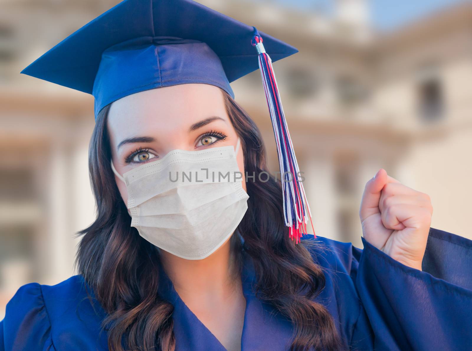 Female Graduate in Cap and Gown Wearing Medical Face Mask by Feverpitched
