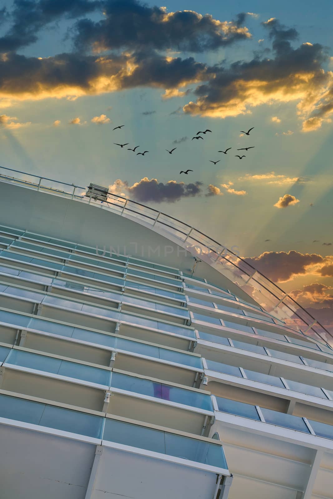 Rows of balconies on a luxury cruise ship into a nice sky