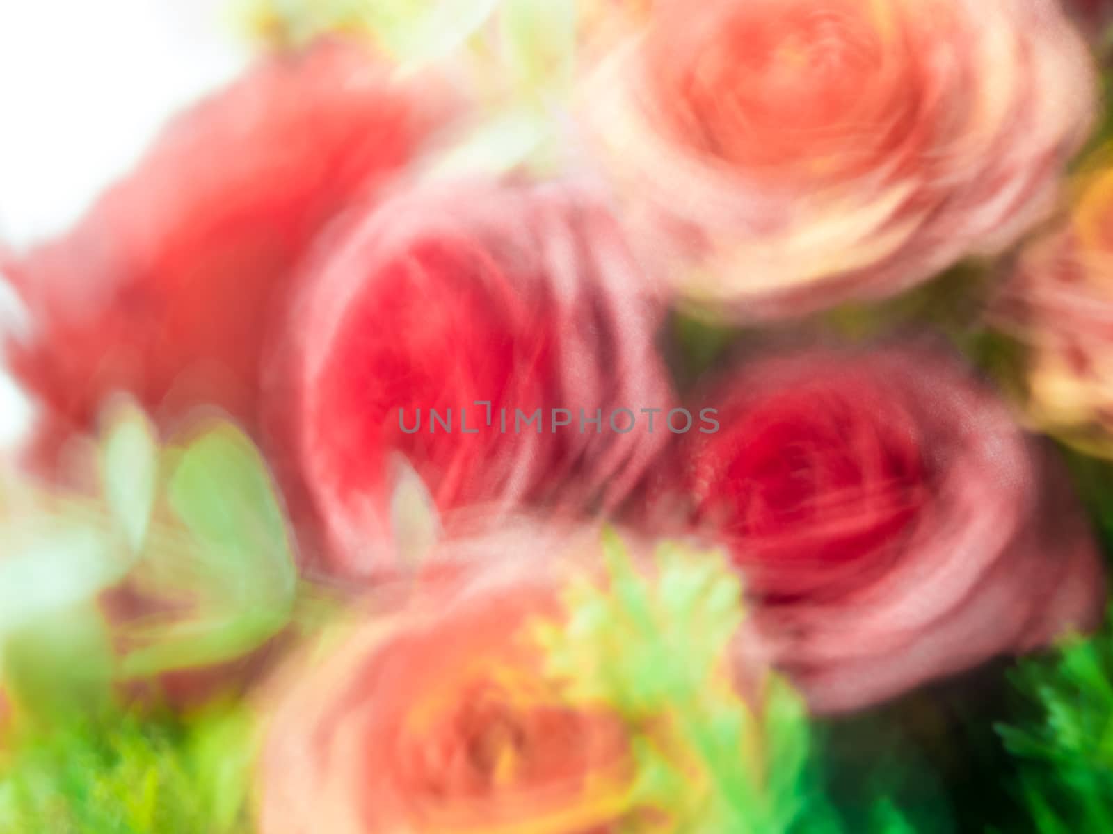 Blurred flowers in artificial flower bouquet by Satakorn
