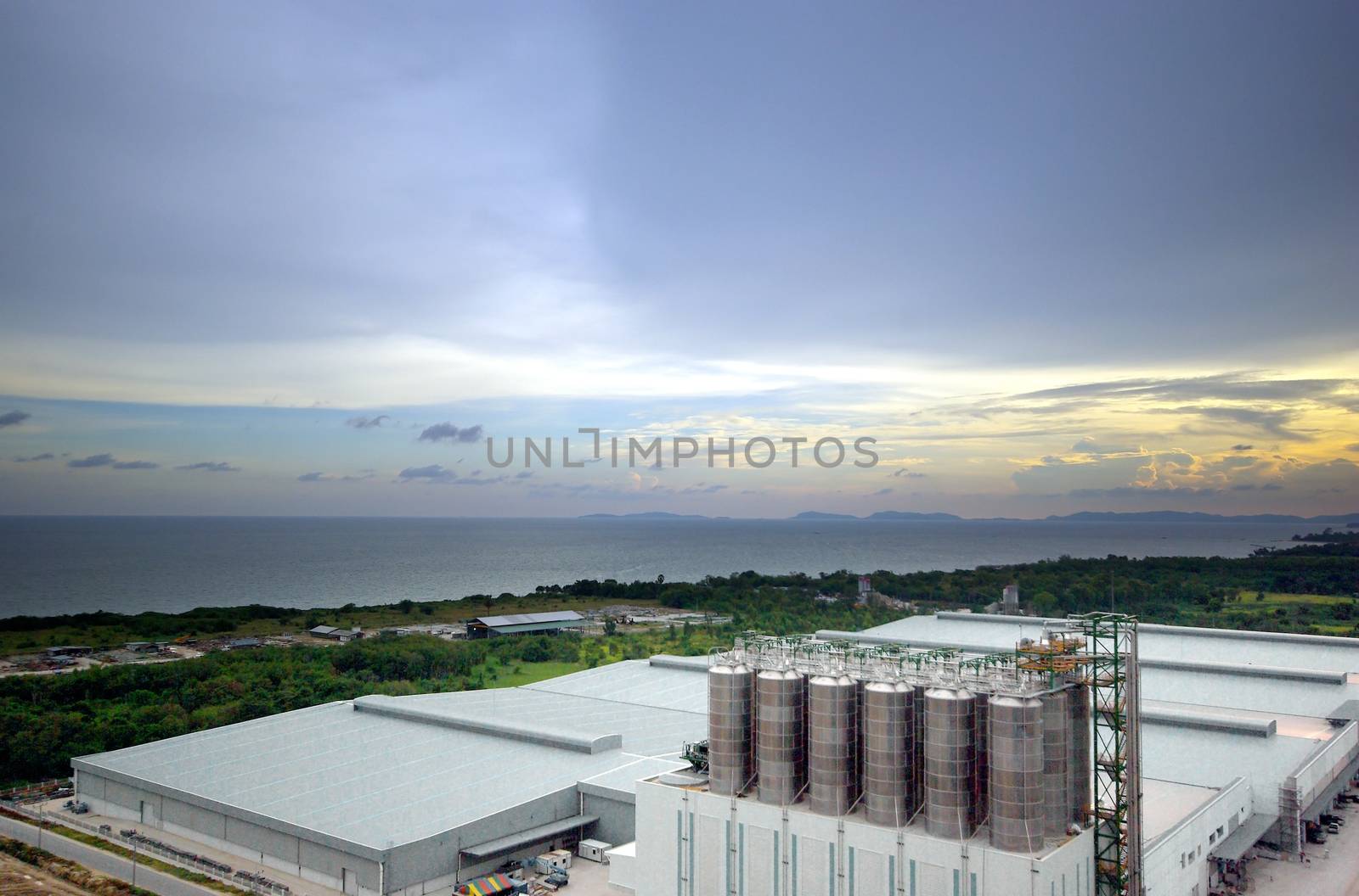 Wideview of under construction Large industrial mill in evening light