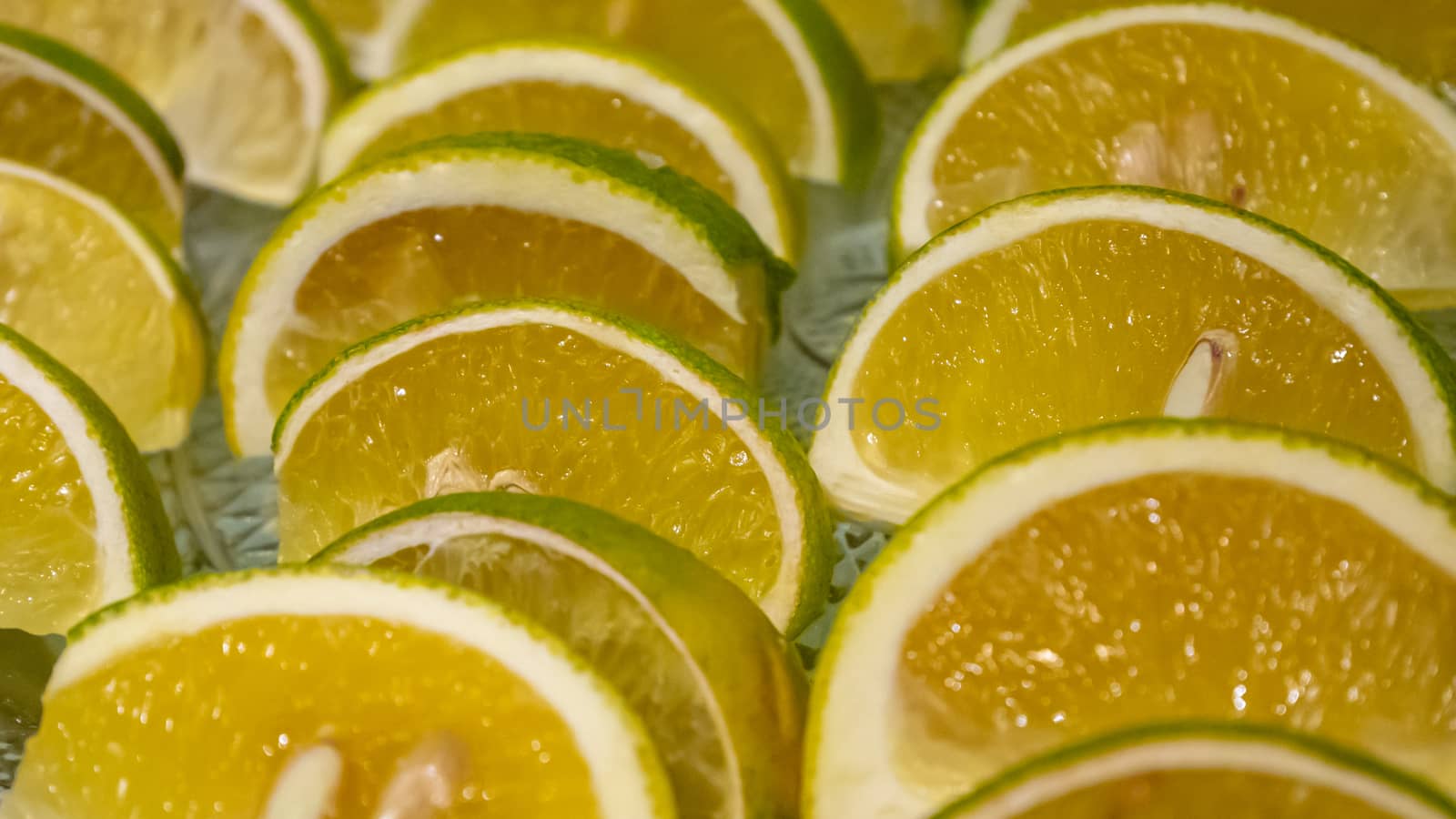 The close up of fresh citrus sinensis fruit (sweet orange) on glass plate.