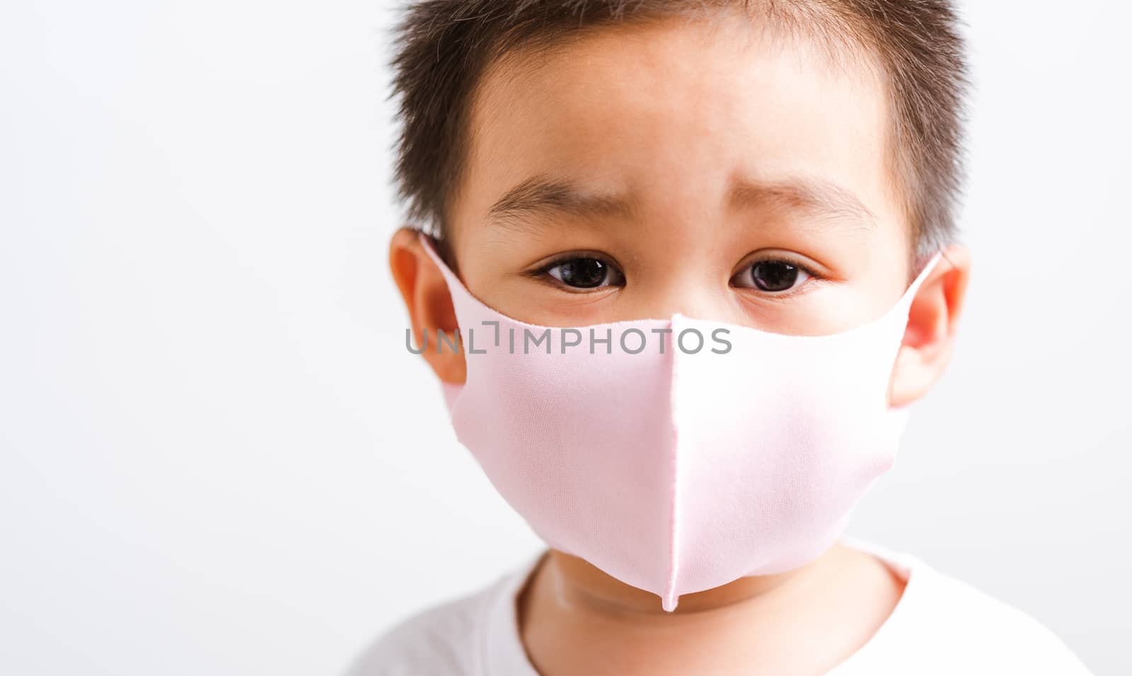 little child boy wearing cloth face mask protective  by Sorapop
