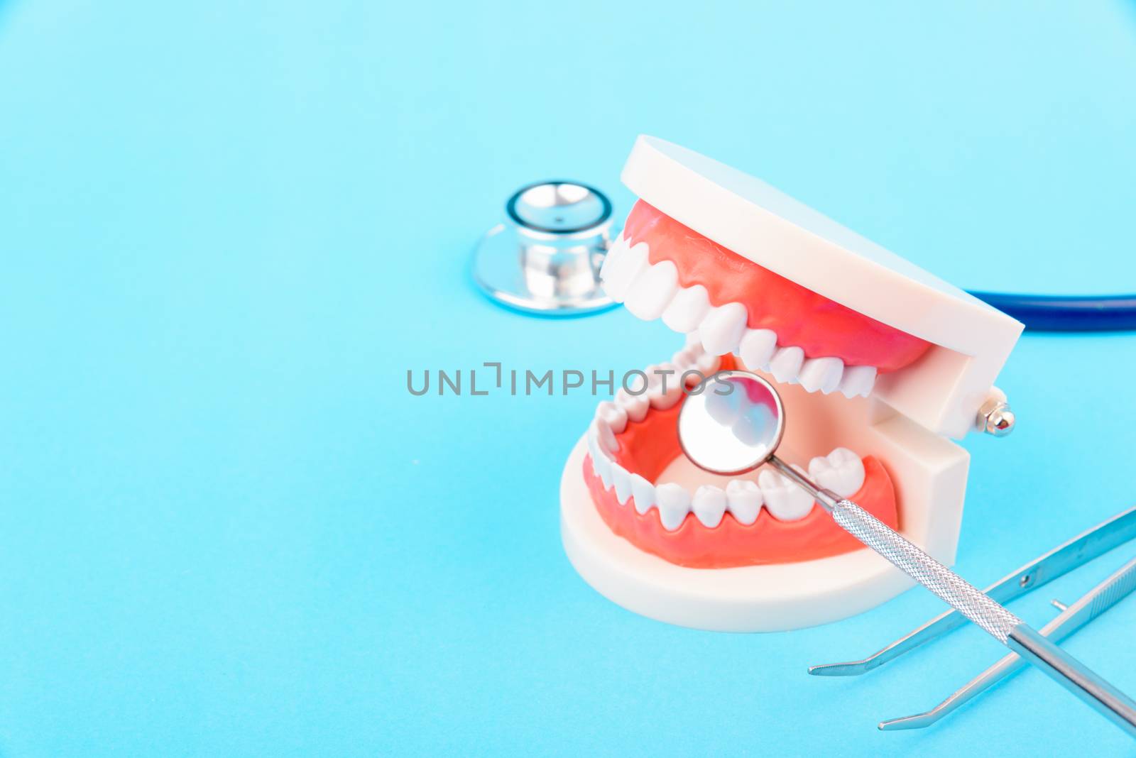 Dental Hygiene Health Concept, White tooth and Dentist tools for by Sorapop