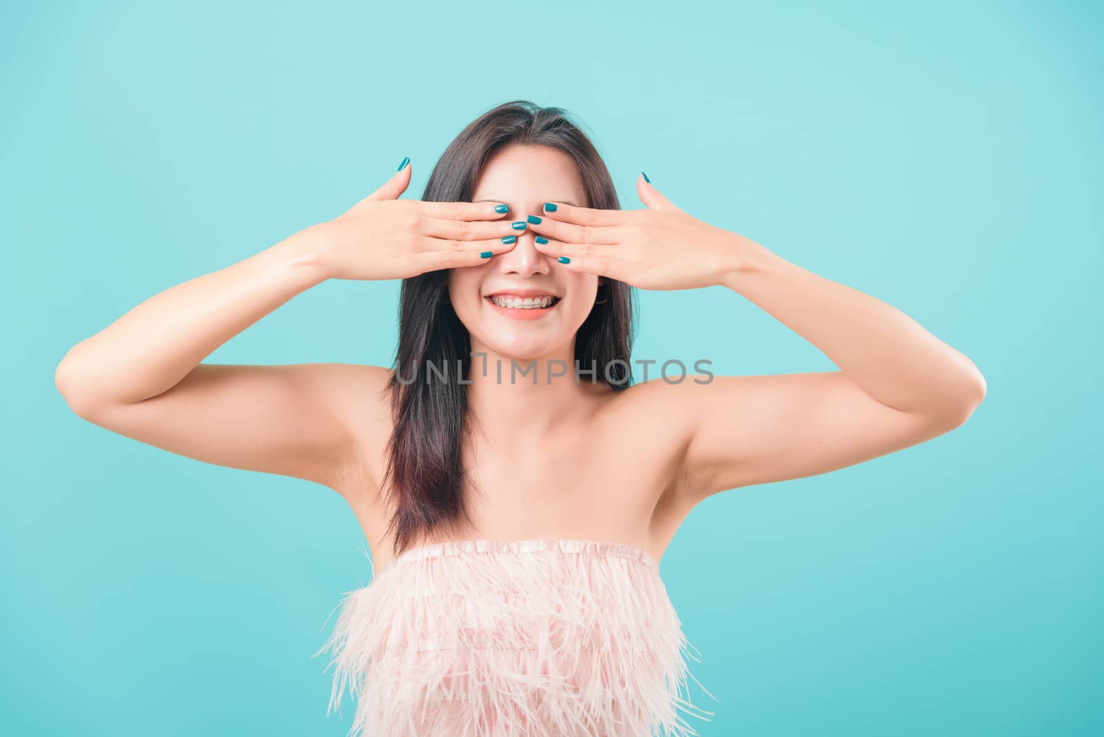 woman standing her covering eyes by hands by Sorapop