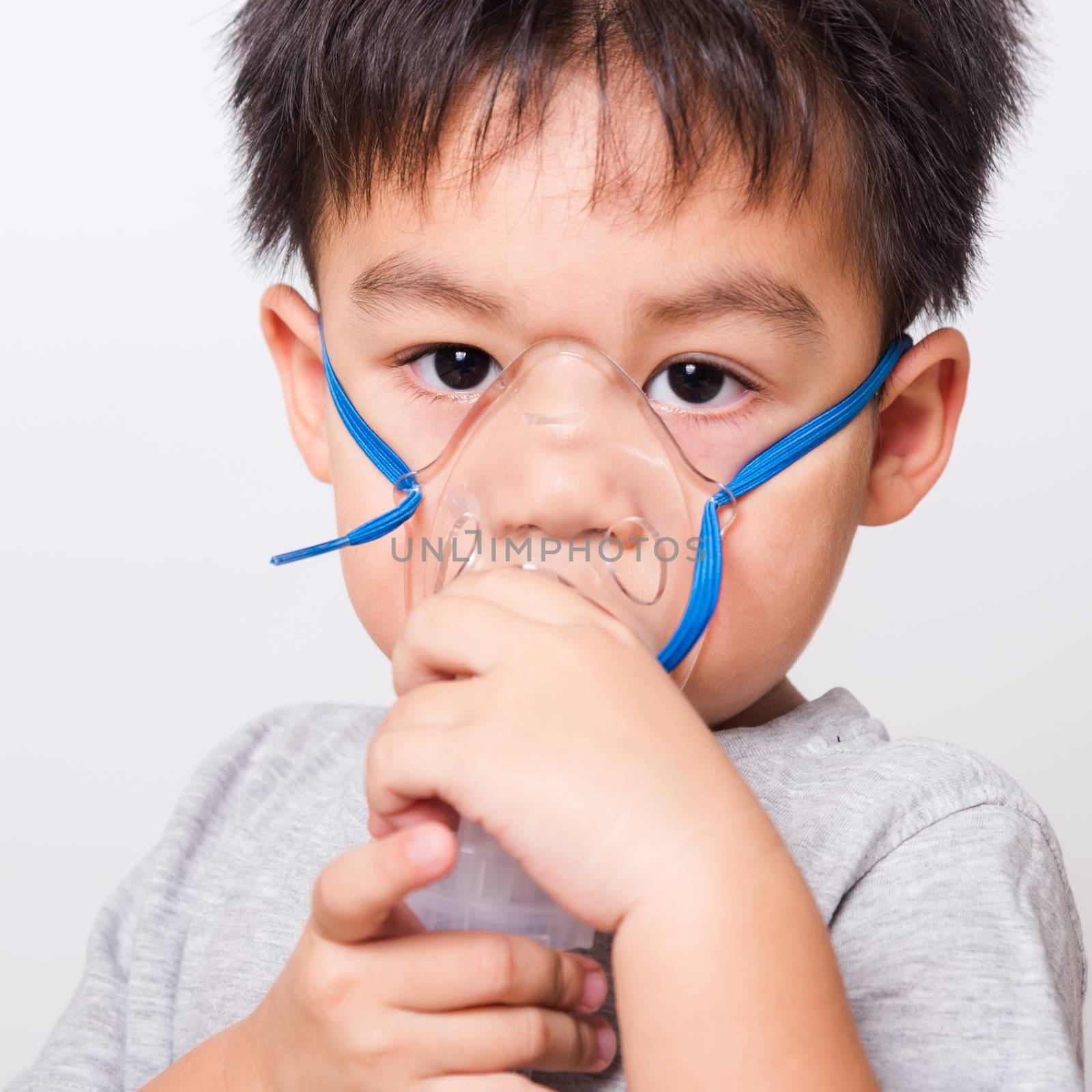 Closeup Asian face, Little children boy sick he using steam inha by Sorapop