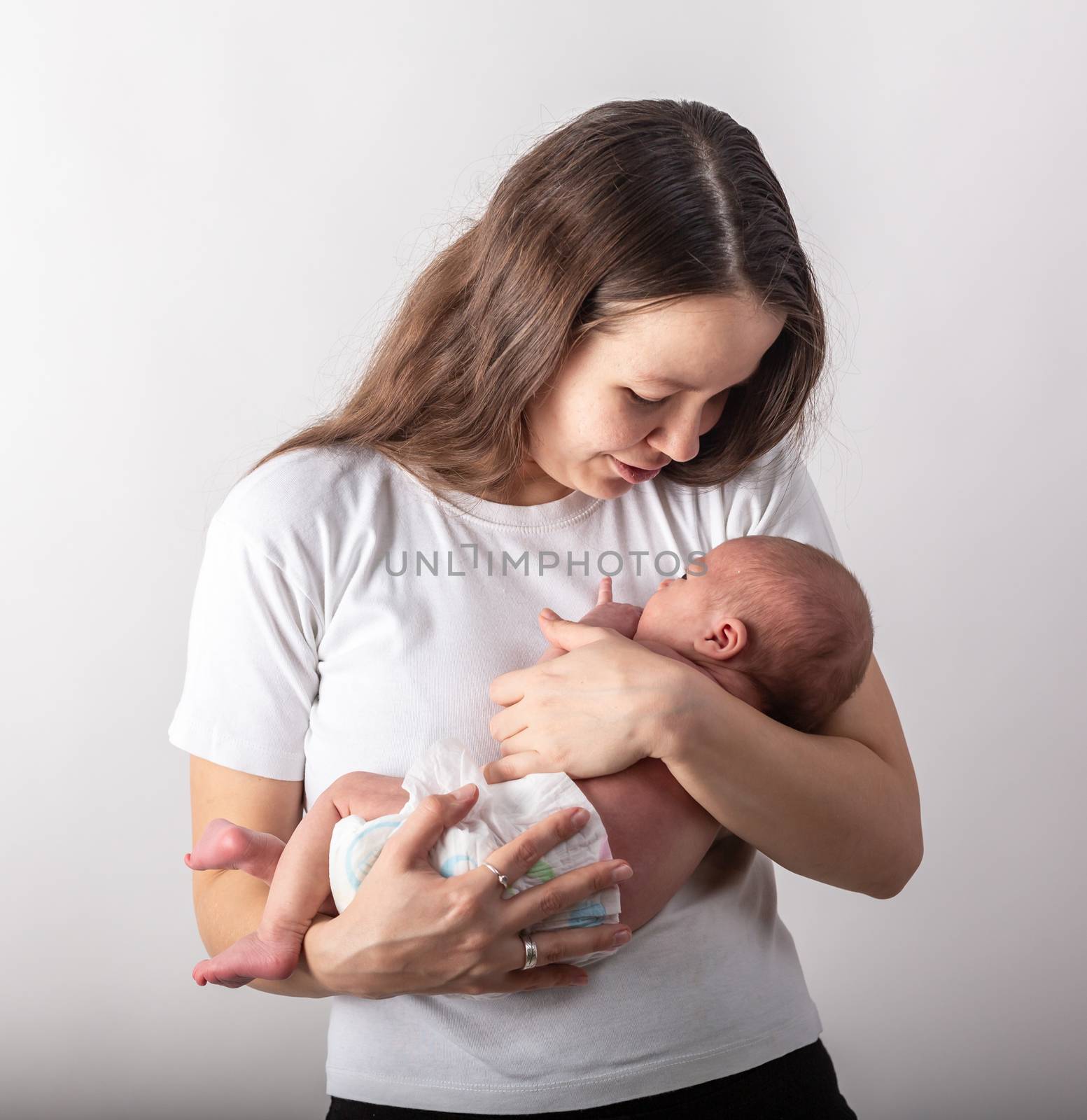 Mother and Baby kissing and hugging. Happy Family.