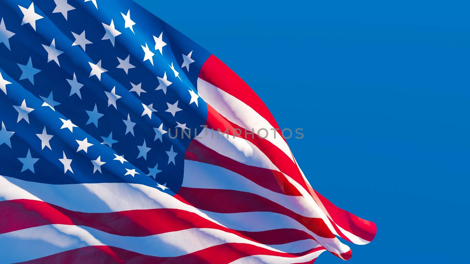The national flag of the United States of America is flying in the wind.